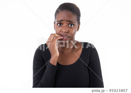 Portrait of nervous African American woman 95023807