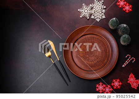 Christmas decoration elements as well as gingerbread on a brown concrete background 95025542