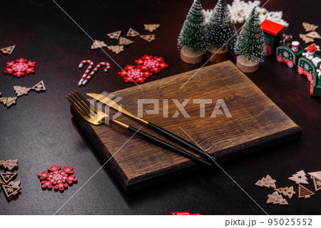 Christmas decoration elements as well as gingerbread on a brown concrete background 95025552