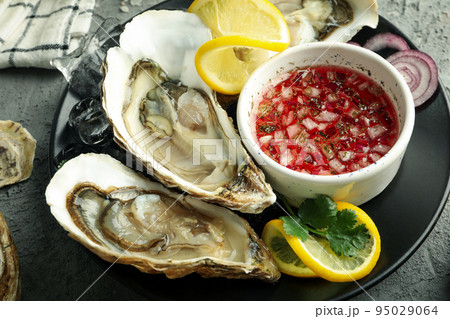 Concept of delicious seafood, oysters, close up 95029064