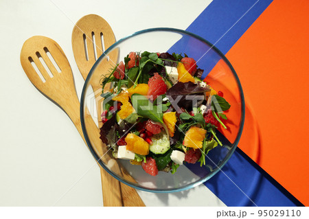 Concept of tasty food with salad with red orange Concept of tasty food with salad with red orange 95029110