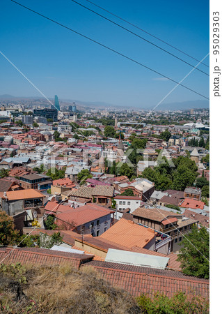 Tbilisi, Georgia - October 1 2022: Beautiful panoramic aerial view of Tbilisi at sunset 95029303