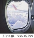 view from the airplane window on feather clouds 95030199