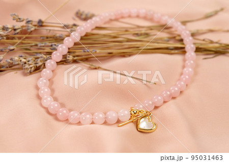 Genuine Natural Pink Quartz Untreated Natural Real Gemstone Beads close up. Genuine Natural Pink Quartz Untreated Natural Real Gemstone Beads close up. 95031463