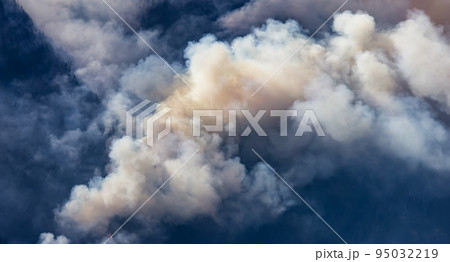BC Forest Fire and Smoke over the mountain near Hope during a hot sunny summer day. 95032219