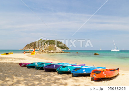 A row of kayak ready to be rented at Yanui beach Phuket Thailand, destination tropical beach for tourist with the blue ocean in Thailand 95033296