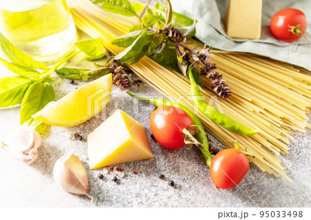 Italian food background. Cooking traditional italian pasta. Ingredients on a stone tabletop. Italian food background. Cooking traditional italian pasta. Ingredients on a stone tabletop. 95033498