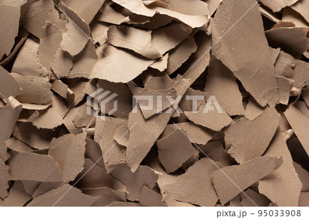 Pieces of torn paper as background. Recycling concept and heap of waste cardboard Pieces of torn paper as background. Recycling concept and heap of waste cardboard 95033908