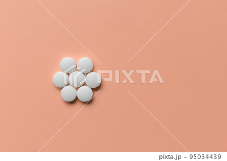 Pills on pink background, supplement, medicine concept. Closeup, copy space 95034439