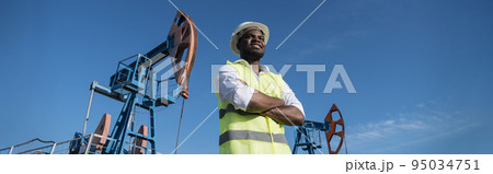 African American developer explores location of pump jacks African American developer explores location of pump jacks 95034751