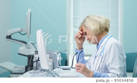 Female doctor enters results of ultrasound to main website Female doctor enters results of ultrasound to main website 95034856