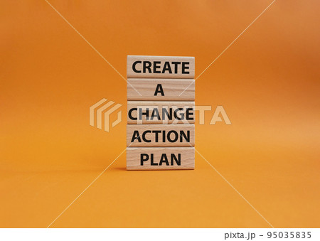 Create a change action plan symbol. Business Concept words Create a change action plan on wooden blocks. Beautiful orange background. Business and Create a change action plan concept. Copy space 95035835