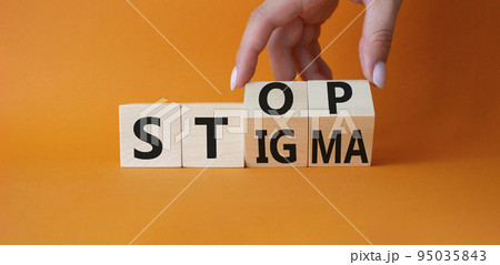 Stop and Stigma symbol. Concept words Stop and Stigma on wooden cubes. Beautiful orange background. Businessman hand. Business and Stop and Stigma concept. Copy space. Stop and Stigma symbol. Concept words Stop and Stigma on wooden cubes. Beautiful orange background. Businessman hand. Business and Stop and Stigma concept. Copy space. 95035843