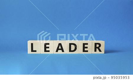 Leader symbol. Concept word Leader on wooden cubes. Beautiful blue background. Business and Leader concept. Copy space. Leader symbol. Concept word Leader on wooden cubes. Beautiful blue background. Business and Leader concept. Copy space. 95035953