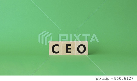 CEO symbol. Concept word CEO on wooden cubes. Beautiful green background. Business and CEO concept. Copy space. 95036127
