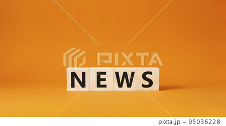 News symbol. Concept word News on wooden cubes. Beautiful orange background. Business and News concept. Copy space. News symbol. Concept word News on wooden cubes. Beautiful orange background. Business and News concept. Copy space. 95036228