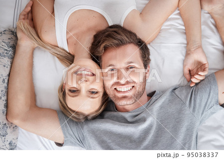 Couple portrait, above bed and smile for love marriage in bedroom, happy with support and content with sleep. Top view face of calm man and woman in happiness together after sleeping in apartment 95038337