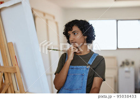 Paint, art and idea with a woman thinking about an artistic project in her design studio for creative expression. Painter, artistic and creativity with a painter doubt or confused in a workshop 95038433