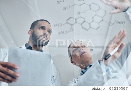 Scientist team, science and chemistry formula on glass board while solving or discuss experiment or solution in a medical laboratory. Innovation, discovery and development with biology man and woman 95039597