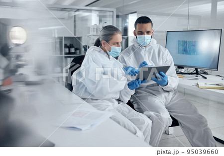 Research, covid and tablet with doctors reading information for work discussion. Medical, team and PPE for safety, health and wellness while doing research on coronavirus together in lab at hospital Research, covid and tablet with doctors reading information for work discussion. Medical, team and PPE for safety, health and wellness while doing research on coronavirus together in lab at hospital 95039660