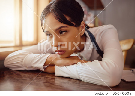 Sad waiter in Paris cafe, woman tired at table in bistro and hospitality service industry job. Disappointed face in small business, bored fatigue at restaurant and mental health depression at work 95040005