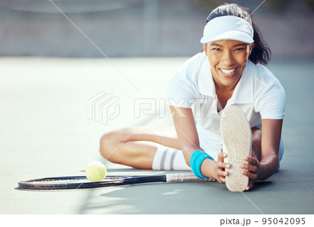 Tennis, exercise and fitness with a sports woman stretching to warmup for a game or match on a court outside. Training, workout and health with a female athlete getting ready to start a routine 95042095