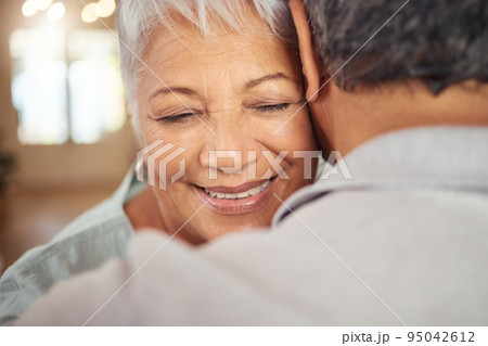 Love, smile and elderly couple hug in their home, happy and relax while bonding and embracing. Care, affection and calm mature man and woman enjoying romance, intimacy and retirement in their home Love, smile and elderly couple hug in their home, happy and relax while bonding and embracing. Care, affection and calm mature man and woman enjoying romance, intimacy and retirement in their home 95042612