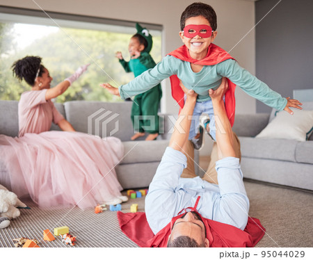 Happy parents and children in costume playing, bonding and having fun together in living room. Happiness, excited and family enjoying fantasy dress up for halloween entertainment with kids at home. 95044029