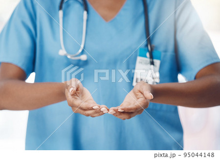 Hands of hospital nurse offer help, trust and support with health safety, healing and healthcare. Black woman, medicine clinic worker or medical employee palm lifting and hope for wellness motivation 95044148