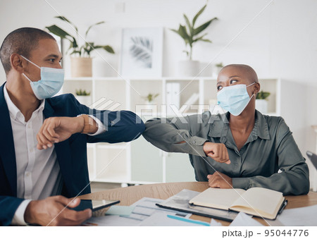 Covid face mask and business people in meeting with elbow greeting, teamwork and collaboration together in the workplace or office. Corporate workers with motivation planning strategy in corona virus 95044776
