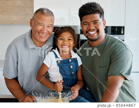 Family baking, food portrait and girl cooking with grandparent and father, happy in the kitchen together and preparing lunch with love in house. Child, dad and elderly person with smile making dinner Family baking, food portrait and girl cooking with grandparent and father, happy in the kitchen together and preparing lunch with love in house. Child, dad and elderly person with smile making dinner 95044867