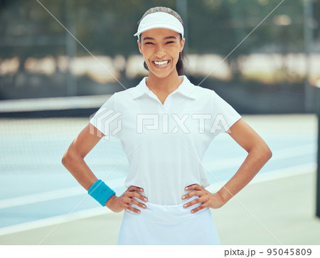 Tennis, fitness and portrait of sports woman with training, exercise and workout in outdoor tennis court. Happy, smile and wellness health girl ready for practice, training or game. 95045809