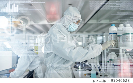 Science, research and covid with an engineer working in a medical lab for innovation and development with overlay. Analytics, medicine and futuristic with a hazmat scientist at work in a laboratory 95046628