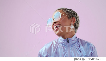 Happy black woman, beauty and fashion sunglasses, retro and cool vintage look. Model, female and unique style, costume or designer jacket outfit and jewelry isolated on pink studio mockup background. 95046758