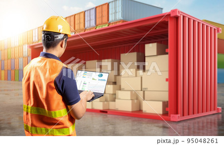 Engineer or worker work with computer notebook at container terminal 95048261