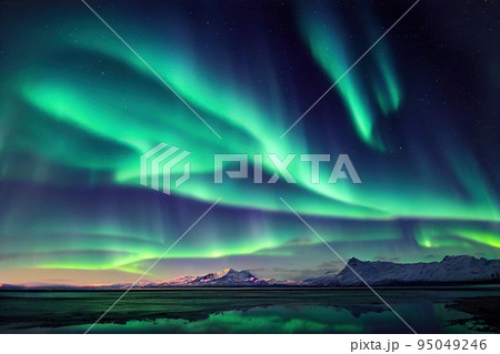 Aurora borealis above mountains and river or lake landscape. Neon green northern lights in night sky fantastic winter epic magical landscape panoramic view. Natural tranquil scene background Aurora borealis above mountains and river or lake landscape. Neon green northern lights in night sky fantastic winter epic magical landscape panoramic view. Natural tranquil scene background 95049246