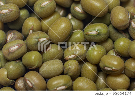 Macro close-up photo of green mung bean grains - Asian golden beans Vigna radiata. Top view, layout. Source of protein and fiber, vegetarian food 95054174
