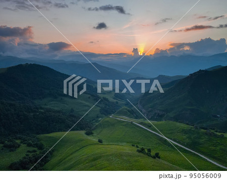 Scenic mountain sunrise landscape in mountains of Caucasus 95056009
