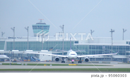 MUNICH, GERMANY - 11 OCTOBER 2015: Lufthansa Airbus A330-300 passenger plane taxiing at Munich Airport MUC 95060303