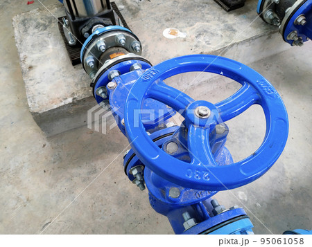 JOHOR, MALAYSIA -AUGUST 1, 2022: Pipe valve is used to control the quantity of water or liquid passing through a pipe. This valve is also used for pipe connections. 95061058