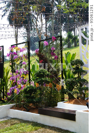 JOHOR, MALAYSIA -MAY 3, 2022: Flower and shrub planter boxes are built in public parks. Exposed to the weather and only hardy plants are planted here. 95061291