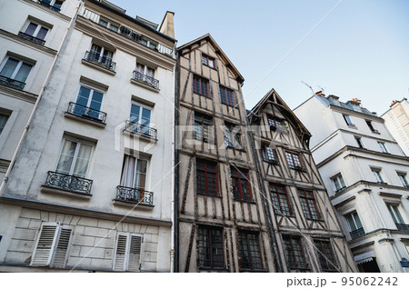 Old medieval style timber framed house in Paris situated in the heart of Le Marais district in Paris, France 95062242