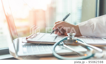 Telehealth, telemedicine medical service and online health care concept with doctor giving medical prescription, analyzing patient health in hospital working on computer laptop Telehealth, telemedicine medical service and online health care concept with doctor giving medical prescription, analyzing patient health in hospital working on computer laptop 95062598