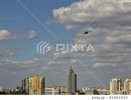 Military helicopter in the sky over Kyiv city, Ukraine. 95063423