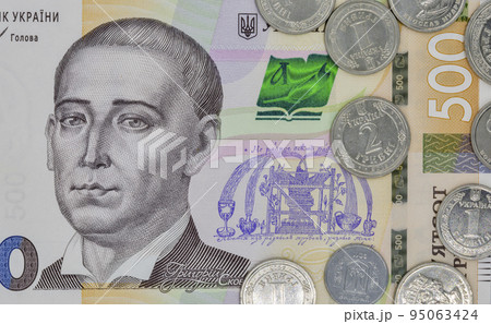 five hundred ukrainian hryvna banknote and coins closeup 95063424