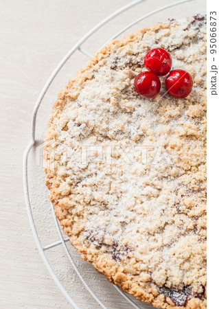 cake with crumb and cherry, close-up 95066873