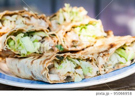 meat in a pita bread in a cut 95066958
