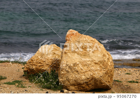 Stones in a city park on the Mediterranean coast in Israel. Stones in a city park on the Mediterranean coast in Israel. 95067270
