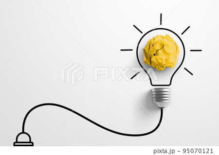 Paper scrap ball yellow colour with light bulb symbol on white background 95070121