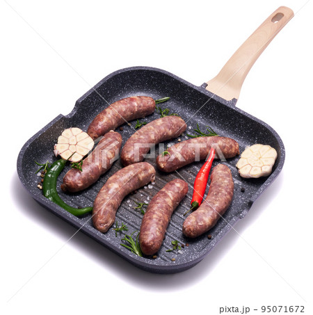 Raw beef or pork grill sausage on grill frying pan isolated on white background Raw beef or pork grill sausage on grill frying pan isolated on white background 95071672